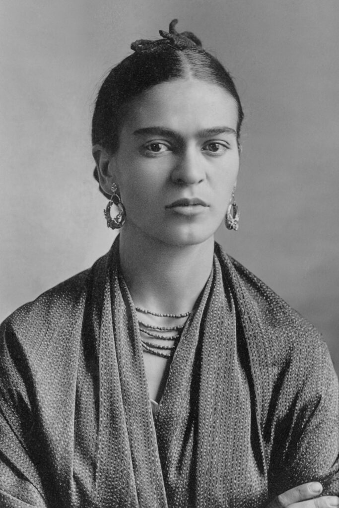 A photo of Frida Kahlo, a renowned Mexican artist and feminist icon, known for her powerful self-portraits and her activism in the fight for gender equality and indigenous rights.