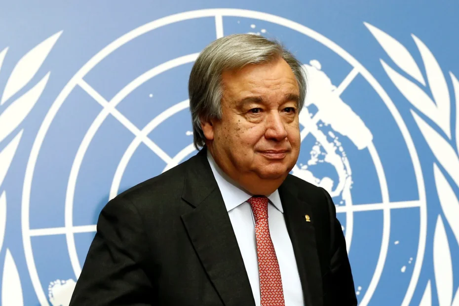 A photo of UN Secretary general Antonio Guterres with a UN emblem as a backdrop