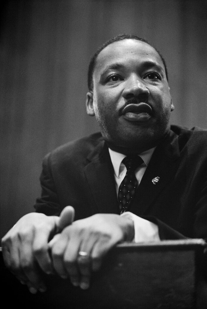 A photo of Martin Luther King Jr., a prominent civil rights leader, known for his role in advocating for racial equality and his leadership in the American civil rights movement.