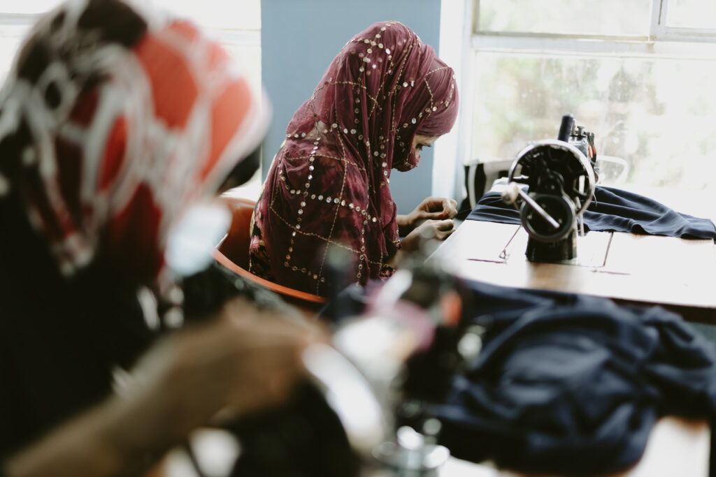 Sex trafficking survivors working sewing with Hagar International 