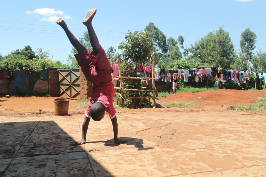 African child doing a handstand