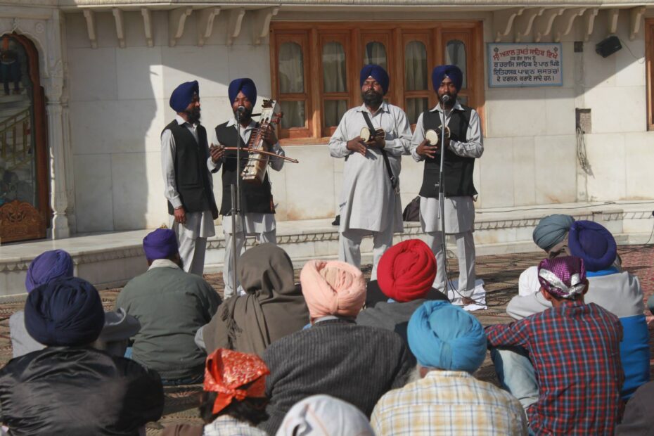 Punjabi men playing music in Amritsar temple in India